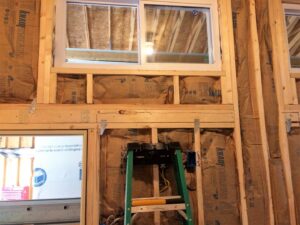Insulation batts installed within wall framing by ADDICT INSULATION, LLC in St. Charles, MO.