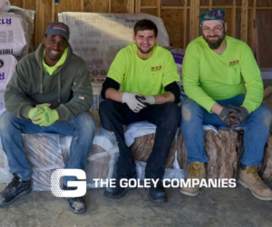 Prairie Insulation LLC crew members sitting on insulation materials at a job site in Springfield, IL.