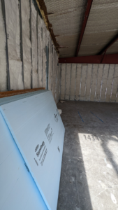 Styrofoam insulation boards stacked on a construction site by Rivera Services in Chandler, TX.