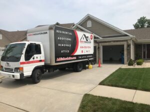 An ADDICT INSULATION, LLC service truck parked at a residential home, ready for insulation work in St. Charles, MO