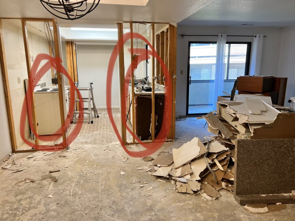Interior demolition debris, including drywall and wood, piled in a home, ready for junk removal by Pack N Haul in West Valley City, UT.