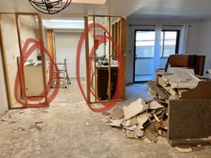 Interior demolition debris, including drywall and wood, piled in a home, ready for junk removal by Pack N Haul in West Valley City, UT.