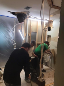 Workers performing interior demolition and renovation work for Daley Construction, LLC in Tampa, FL.