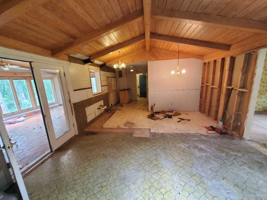 Interior of a house undergoing demolition and renovation with exposed studs and tools by GCI Services, Inc. in Simpsonville, SC
