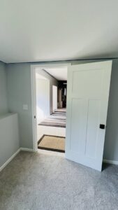 A newly installed interior door with fresh trim paint, showcasing door installation services by Clear Choice Handyman LLC in Woodbury, MN.