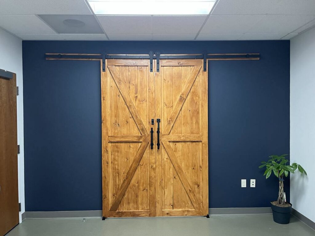 Interior double wooden barn doors installed by Prime Construction ent. in Bloomingburg, NY
