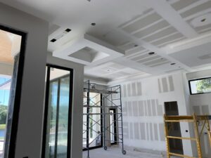 Interior drywall construction with complex ceilings and scaffolding by D&G Drywall in Fort Lauderdale, FL