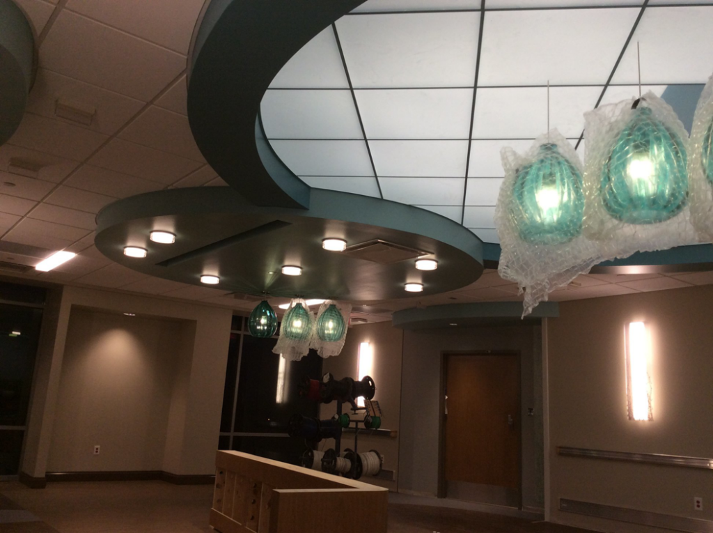 An interior finishing project featuring a decorative ceiling and pendant lights by Combs Interior Specialties in Columbus, OH.