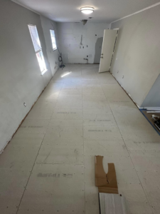 Interior room with subfloor installed, ready for new flooring by J&N Innovations LLC in Tulsa, OK.