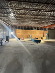 An interior space under construction with new framing and tools, showcasing handyman services by Classic Design Builders in Virginia Beach, VA.