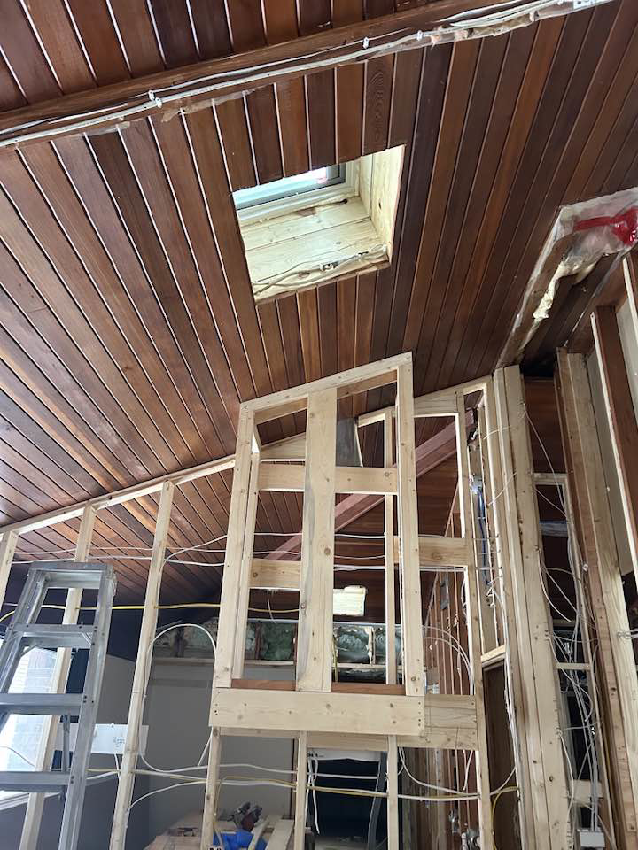 Interior framing and a skylight opening during a renovation project by Haus Builders in Goodhue, MN