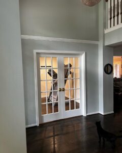 Newly installed interior French doors with fresh paint and crown molding, completed by J.C.Improvement in Katy, TX.
