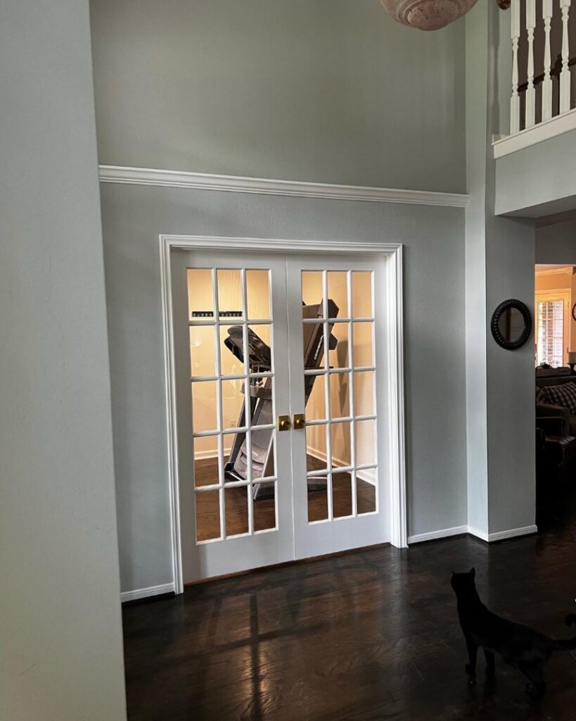 Newly installed interior French doors with fresh paint and crown molding, completed by J.C.Improvement in Katy, TX.
