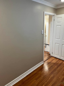 An interior hallway with fresh paint and new trim installed by DunnWright Contractor in Pensacola, FL.