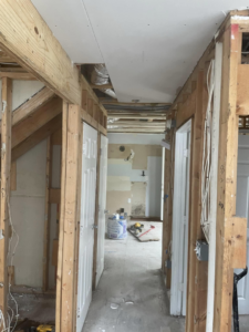 Interior home renovation showing wood framing and electrical rough-in by Wise Construction Group in Atlanta, GA.