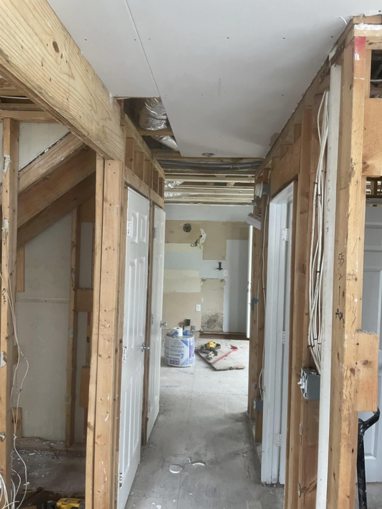 Interior home renovation showing wood framing and electrical rough-in by Wise Construction Group in Atlanta, GA.