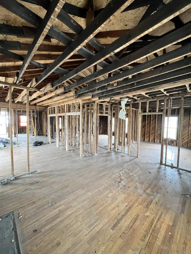 Interior view of a house showing exposed wooden framing during a remodeling project by R&R Foundation and remodeling in Owensboro, KY
