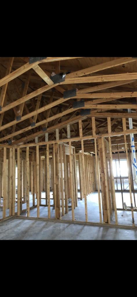 Interior house framing during a renovation project by Port City Remove and Improve in Wilmington, NC