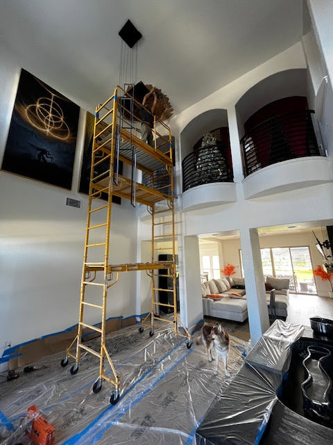 Professional interior painting on high ceilings with scaffolding by San Marcos Drywall and Paint in Austin, TX