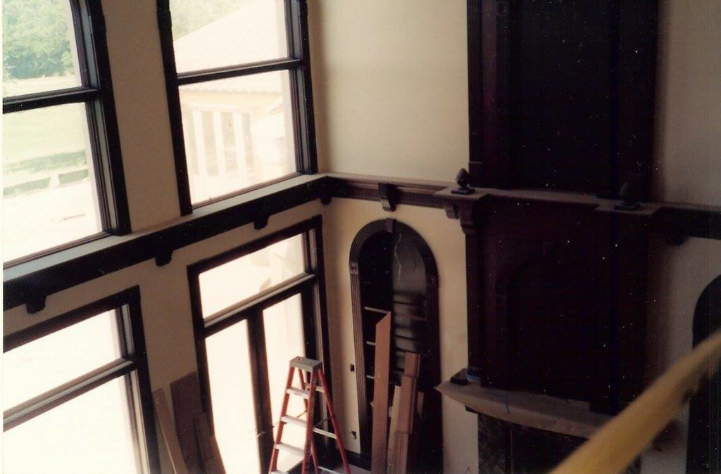 An interior space undergoing renovation with a ladder and wood planks, showcasing work by Honeycomb Handyman Services in Salt Lake City, UT.