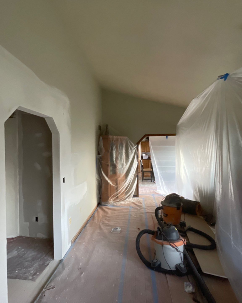 Interior renovation preparation with protective plastic sheeting and shop vacuums by Fix Fast Flip, LLC. in Plainfield, IL.