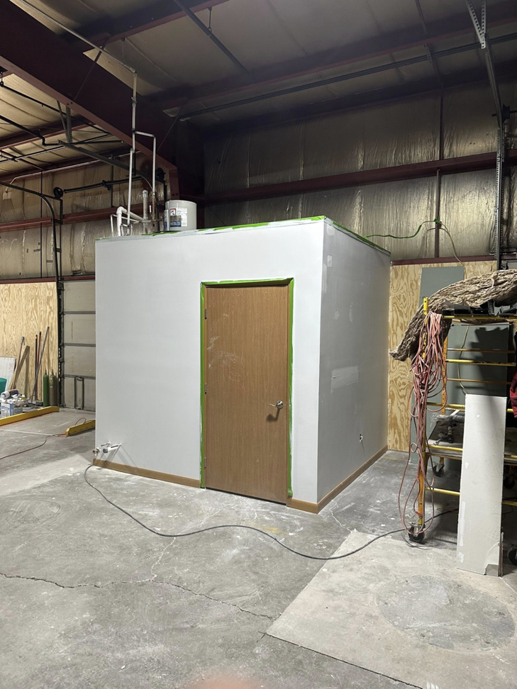 A newly constructed interior room or enclosure within a larger space, built by Tri Lake Construction in Madison, WI