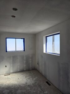 Interior room undergoing drywall finishing and painting preparation by RC Contracting in Chesterfield, MO.