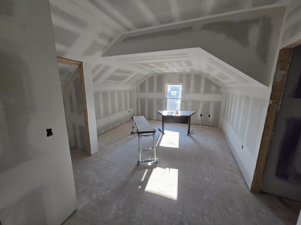 Interior room showing new drywall installation and finishing work by J M Construction & Remodeling in Humble, TX.