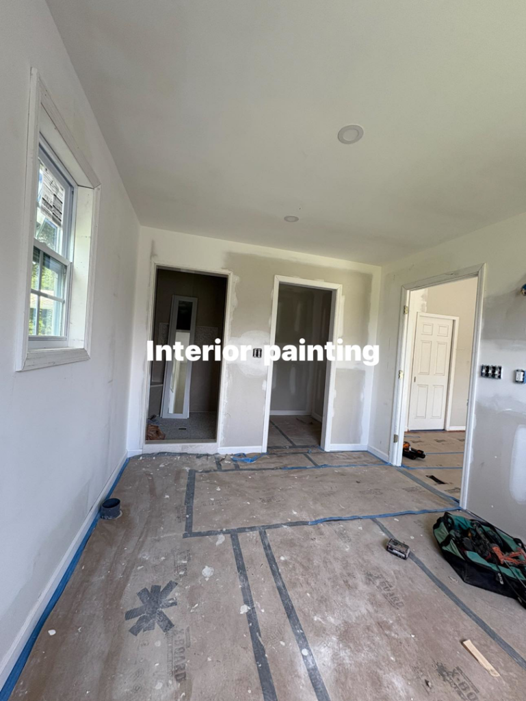 An interior room undergoing drywall and painting preparation by Easier Remodeling LLC in Sandy Springs, GA.