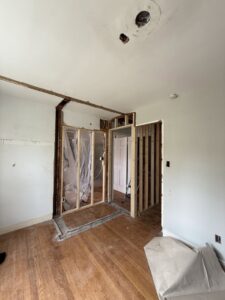 Interior room under renovation showing new framing and construction work by Sanchez & Hall Construction in Richmond, VA.
