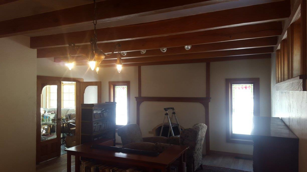 An interior room with a ladder, suggesting painting or handyman work in progress by Above & Beyond Painting, LLC in Green Bay, WI.