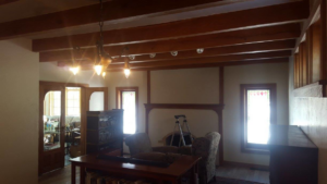 An interior room with a ladder, suggesting painting or handyman work in progress by Above & Beyond Painting, LLC in Green Bay, WI.