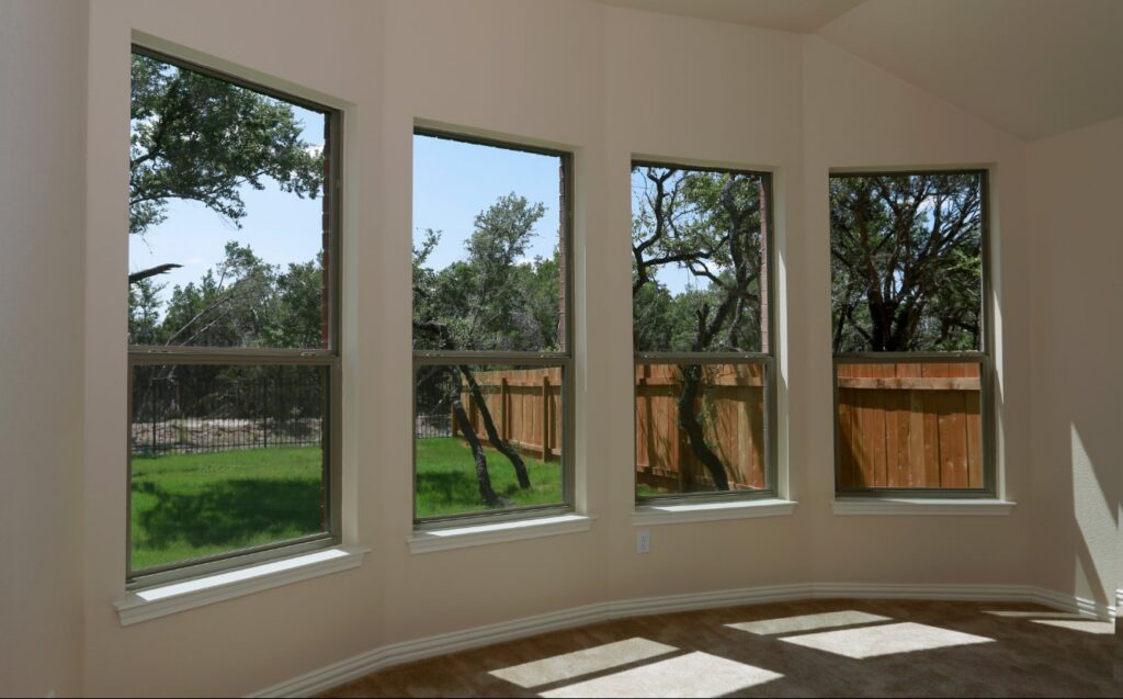 An interior room showcasing new window installation and trim work by Orival Property Services in Boston, MA.