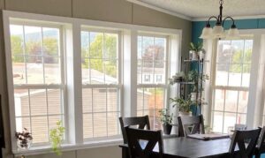 A bright interior room featuring newly installed windows, part of a home renovation by DCM Multi Service llc in Harrisburg, PA.