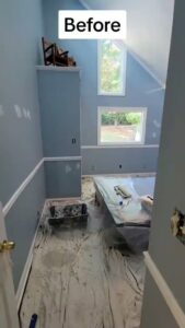An interior room prepped for painting with drop cloths and paint supplies by Prime Painting in Charlotte, NC.
