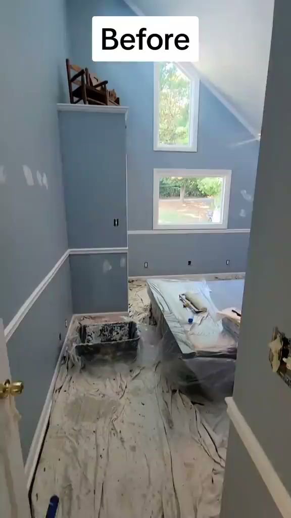 An interior room prepped for painting with drop cloths and paint supplies by Prime Painting in Charlotte, NC.