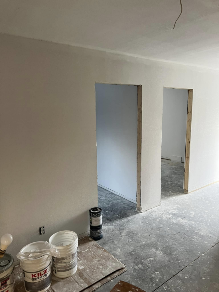 Interior room with walls primed or painted white, showing doorways, by R&R Foundation and remodeling in Owensboro, KY