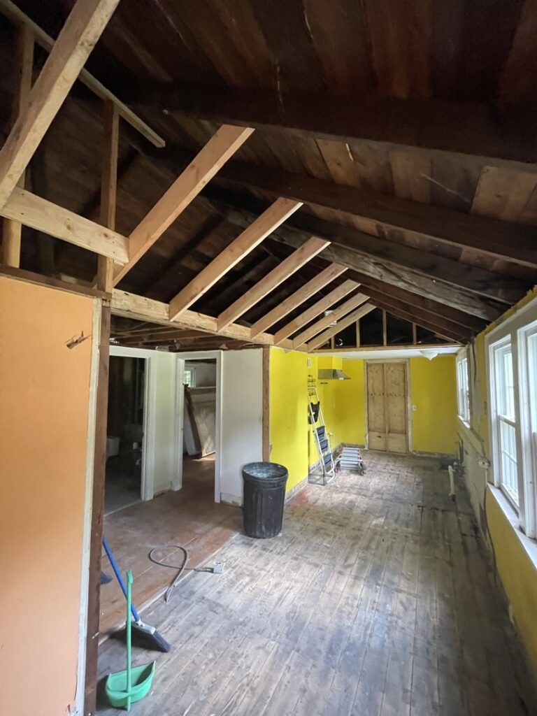 Interior room renovation in progress with exposed ceiling beams by JAC Home Improvement LLC in Danbury, CT.
