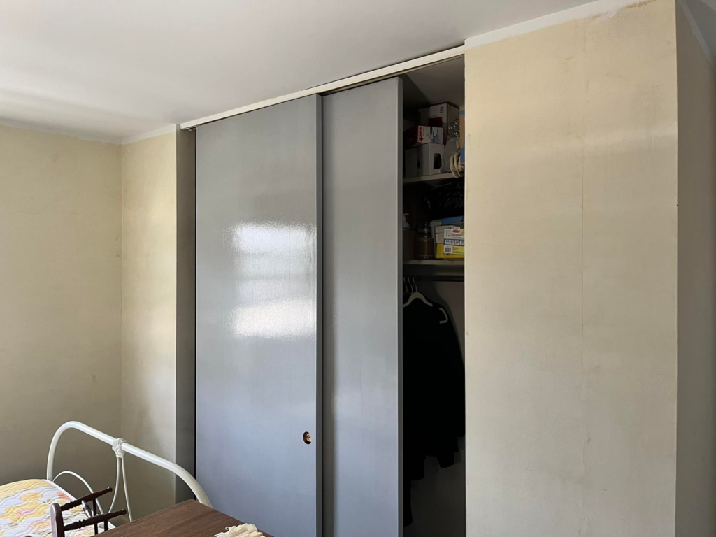 An interior room with walls prepped for painting and a closet with sliding doors by Lambert's Residential Painting And More LLC in Fort Wayne, IN.