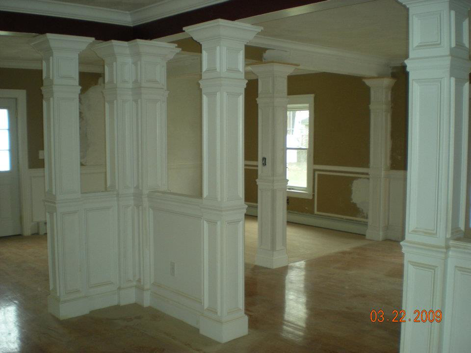 Interior space featuring decorative columns and wainscoting installed by Hammer & Nail Construction in Cumberland, RI.
