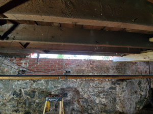 Interior view of floor joists and new sill work during a replacement project by Richard C. Michalak in Worcester, MA.