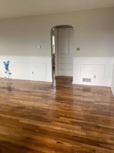 An interior room featuring newly installed wainscoting and painted walls, a renovation service by FES handyman services LLC in Boise, ID.