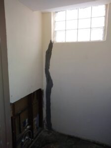 An interior wall showing a repaired crack, indicating structural or waterproofing work by MCG General Contractor in Philadelphia, PA.