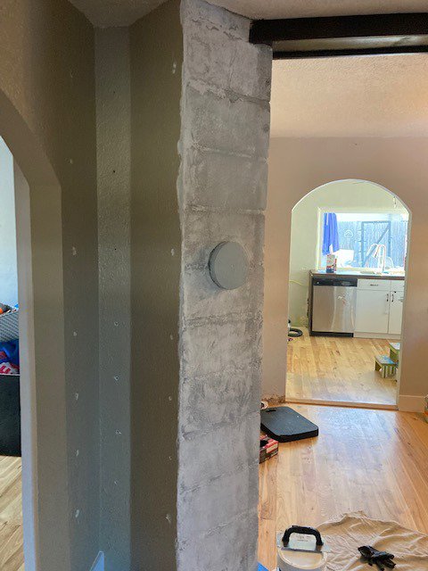 An interior wall with a textured finish, indicating a wall finishing or repair project by Rod's Handyman Services, LLC in Boise, ID.