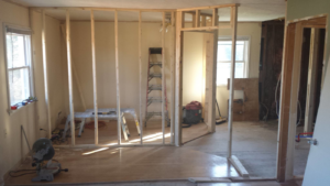 Interior wall framing and renovation work in progress, showing handyman services by Precision Painters in Louisville, KY