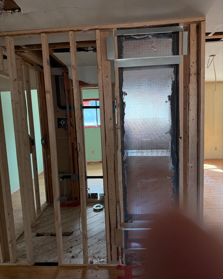 Interior wall framing and drywall installation in progress by Continental Drywall in Aurora, CO