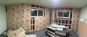 Interior walls framed and insulated during a renovation project by JJT Construction in Portland, OR.