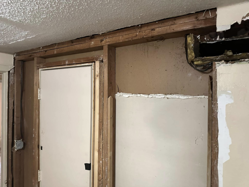 Interior wall framing and renovation work in progress by Snell & Sons Construction LLC, a handyman service in Mobile, AL.