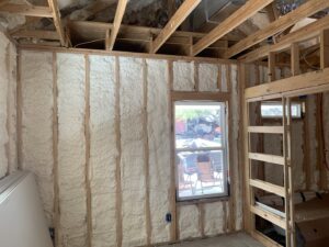 Interior wall framing with spray foam insulation installed by IFOAM Insulation of Hill Country, a general contractor in San Antonio, TX