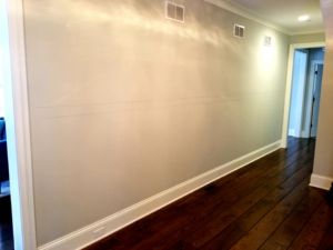 Interior wall preparation with pencil markings for wainscoting installation by F&S Construction Group in Chicago, IL.